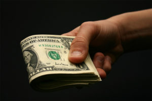 dollar bills in hand