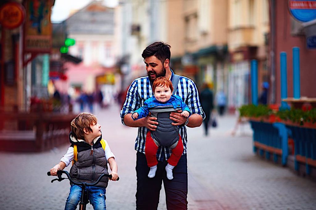 Some eligible parents will get an additional five to eight weeks of parental leave — as long as both parents agree to split time off 3 Happy father raising two kids parental leave Ontario Pivotal HR Solutions Blog