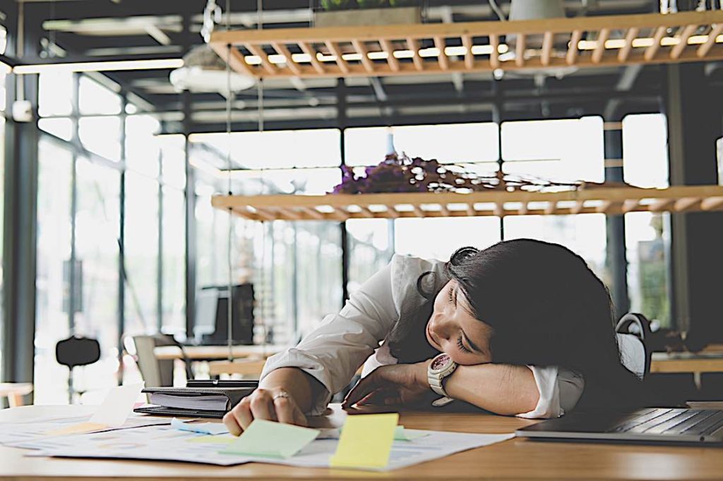 "Dying for a paycheque?" — good HR Managmement can breathe new life into your team 3 Sleeping at desk Pivotal HR Solutions Blog