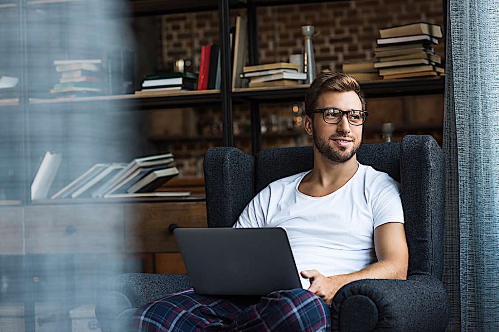 Only 43% of Canadian employees are offered home remote working options; 61% prefer to work remotely 2 Man working from home in pjs Pivotal HR Solutions Blog