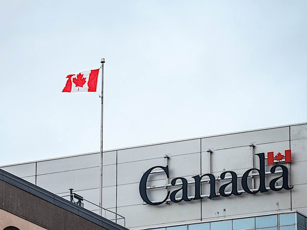 Canadian Government Waives Temporary Waiting Period for EI 2 Canada Trademark and flag dreamstime xxl 133058650 Pivotal HR Solutions Blog