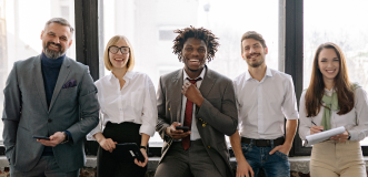 Five Co-workers smiling together